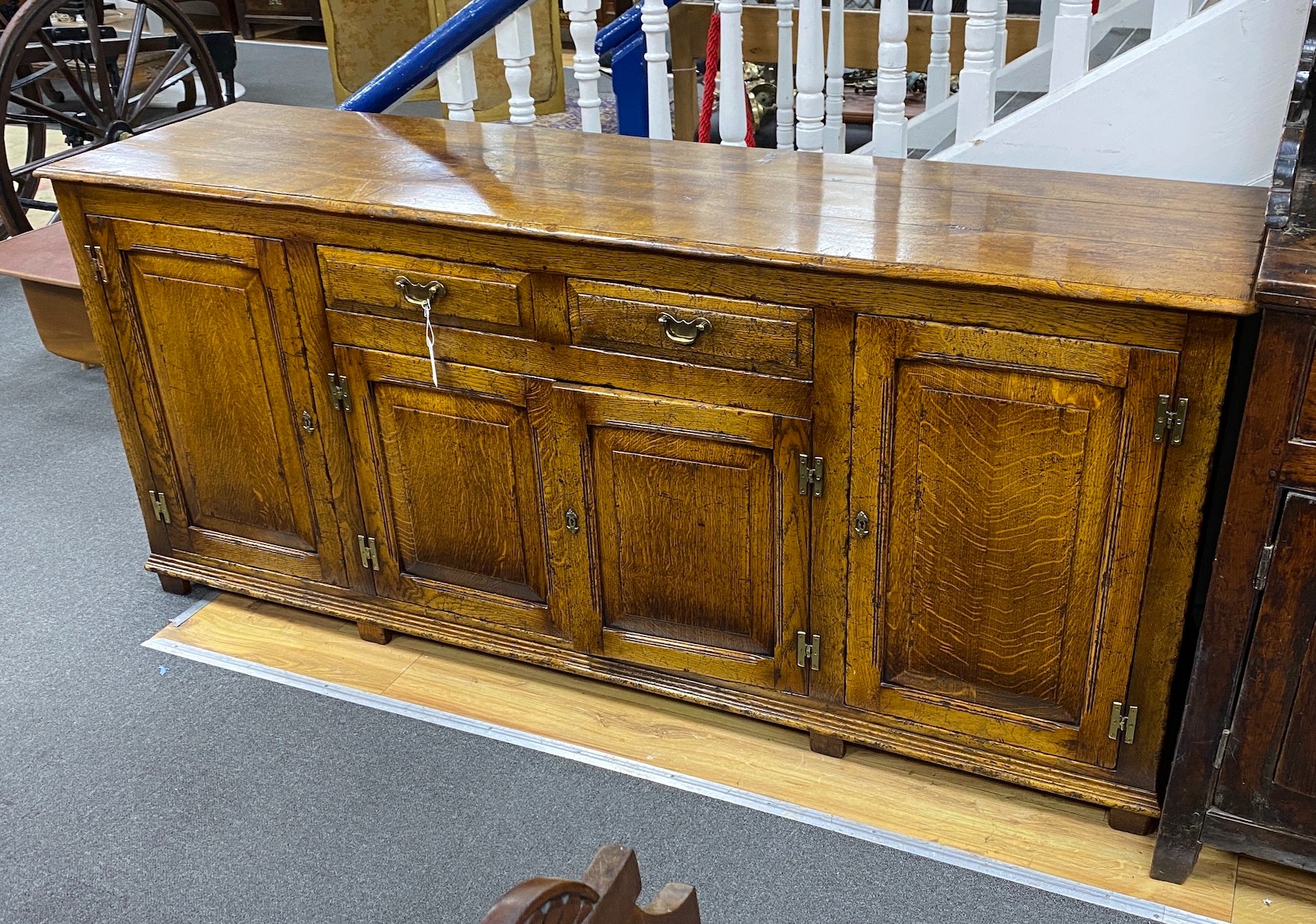 An 18th century style pale oak low dresser, length 190cm, depth 49cm, height 83cm